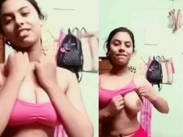 Pink bra girl lifting to show her firm big boobs