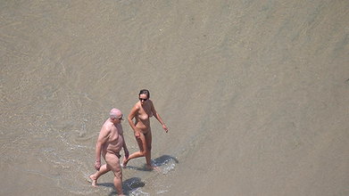 Captivating Beach Voyeur Caught in Topless Action
